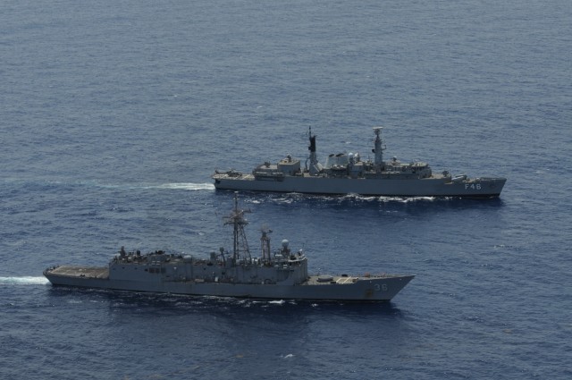 CARIBBEAN SEA (Sept. 11, 2012) The Oliver Hazard Perry-class guided-missile frigate USS Underwood (FFG 36), foreground, conducts tactical maneuvers with the Brazilian frigate BNS Greenhalgh (F-46).