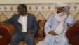 Iyad Ag Ghali, right, leader of Ansar Dine, meets with Burkina Faso foreign minister Djibril Bassole in Kidal, northern Mali, August 7, 2012.