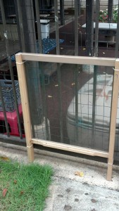 reused crib panel as art easel outside