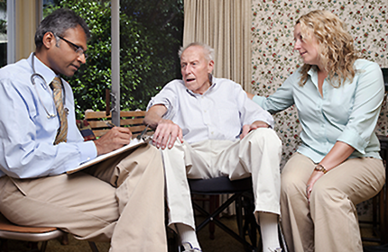 picture of provider with Veteran and his daughter at home