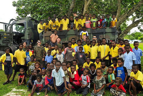 US Marines and local ni-Vanuatu children at a medical assistance project during Pacific Partnership 2011.