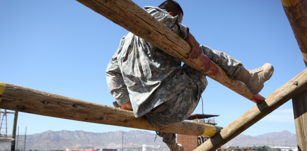 Soldier negotiating obstacle