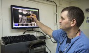 Photo: Lt. Brandon Geddes reviews a patients X-ray aboard the Nimitz-class aircraft carrier USS Dwight D. Eisenhower on Feb. 25, 2013. Dwight D. Eisenhower is deployment in support of Maritime Security Operations and Theater Security Cooperation efforts in the U.S. 5th and 6th Fleet areas of responsibility. U.S. Navy photo by Mass Communication Specialist Seaman Andrew Schneider