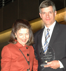 Ron Staudt receives TIG award from LSC President Helaine M. Barnett.