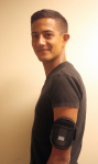 Navy veteran and USO employee Oscar sports a USO MP3 player armband