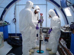 Members of the 2010 Lake Vida expedition team use a sidewinder drill inside a secure, sterile tent on the lake’s surface to collect samples for their research. (Photo: Desert Research Institute, Emanuele Kuhn)