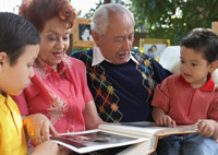Image of family looking at photo album