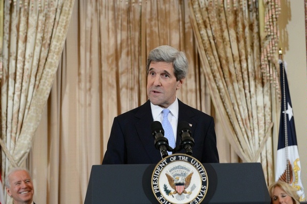 Secretary of State John Kerry delivers remarks during his ceremonial swearing-in at the U.S. Department of State in Washington, DC, February 6, 2013. Also pictured are U.S. Vice President Joe Biden, left, and Dr. Jill Biden, right
