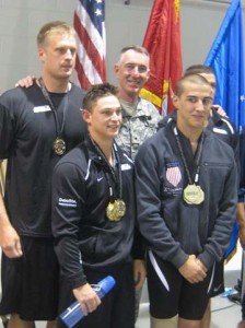 BG Gary Cheek sings the Army Song with gold-medalists from the Mixed 50m Freestyle Relay.  Clockwise from left: SSG Michael Janssen, BG Gary Cheek, SFC Landon Ranker, SGT Cayle Foidel, SGT Gavin Sibayan.  Army athletes took home 29 medals in swimming.