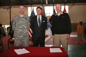 Brig. Gen. Gary Cheek (left) with  Assistant Secretary of the Navy for Manpower and Reserve Affairs Juan Garcia (center) and Vice Adm. Kevin McCoy (right) after signing a memorandum of agreement to increase employment opportunities for wounded warriors.