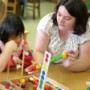 Teacher with small child