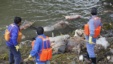 Cleaning workers retrieve the carcasses of pigs from a branch of Huangpu River in Shanghai, March 10, 2013.  