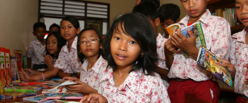 Students read books in a library