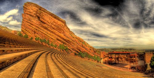 The Red Rocks Amphitheatre is the key feature of Denver’s famous Red Rocks Park, and is a common venue for speakers and entertainers that seats nearly 10,000 spectators. Click through for image source.