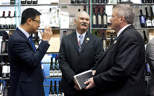 Left to right: Adam Ma from North American Premier Wine Shop, Acting Under Secretary for Farm and Foreign Agricultural Services Michael Scuse, Iowa Secretary of Agriculture Bill Northey at a local Chengdu wine shop, which participated on the first ever reverse mission to the United States in May 2011. This visit is part of the USDA trade mission to China, which is taking place in the cities of Chengdu and Shanghai March 23-28. Photo Credit: Kirsten Allen