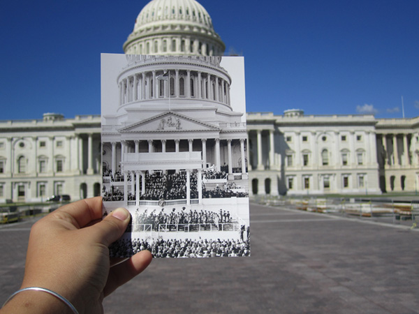 The inaugural stand in front of the Capitol Building, Washington, DC. A shot taken from a distance, showing the guests seated under the stand, a band gathered below it, and a larger crowd seated behind the band. President Harry S. Truman may be speaking at the podium., 01/20/1948.  ARC ID 199970.