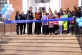 IMG: Visitors gather for a ribbon cutting ceremony