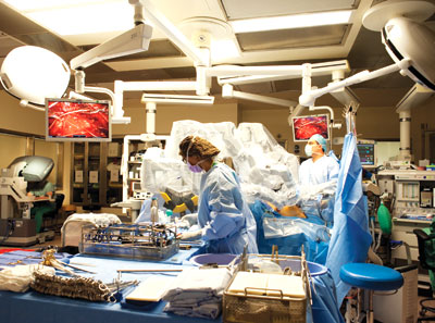 Photo shows Peter A. Pinto, M.D., and colleagues in surgery.