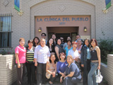 Sixteen women and three men from Washington, DC pose outside of La Clnica Del Pueblo.