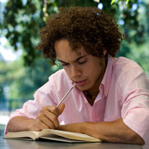 Student reading/studying outdoors