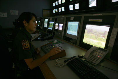 A CBP Border Patrol Agent operates remote camera systems located across the U.S. border trying to located illegals immigrants.