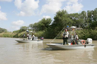 CBP Border Patrol Marine units face toward Mexico to provide cover for other agents on the U.S. side of the river conducting an investigation.