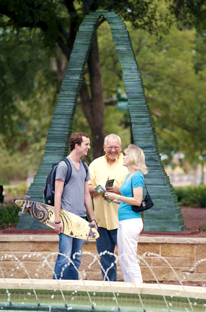 Parents & Student at the fountain on the mall