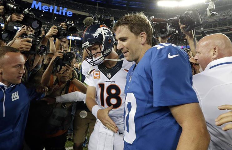 Photo: Peyton and the Denver Broncos get the better of Eli and the New York Giants in the #ManningBowl: http://yhoo.it/1eBX4U2 

Peyton now leads the NFL in TDs, while Eli leads the #NFL in INTs.