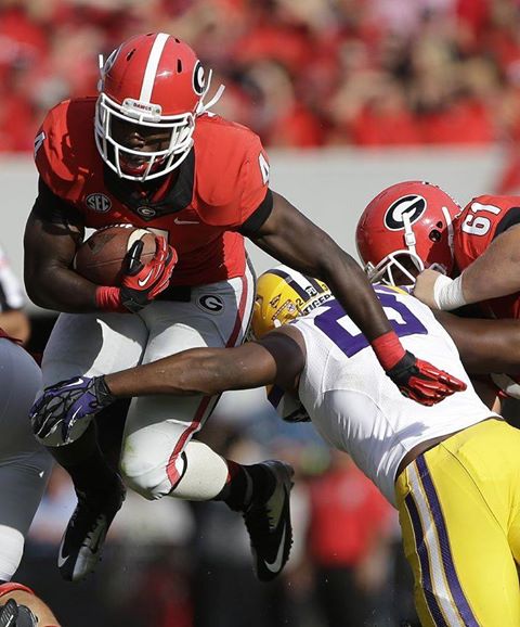 Photo: Aaron Murray threw four touchdown passes as No. 9 University of Georgia rallied to top No. 6 Louisiana State University 44-41 in a well-fought dog fight.  --> http://yhoo.it/1eQiAnf