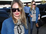 Kate Bosworth shows off her slender legs in skinny jeans as she jets out of LAX in style 