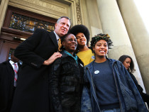 New York Democratic mayoral candidate Bill de Blasio poses with his family, wife Chirlane McCray, son Dante de Blasio and daughter Chiara de Blasio after voting at a public library branch on Election Day on November 5, 2013 in Brooklyn.  (Photo by Spencer Platt/Getty Images)