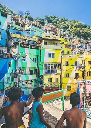 Boys playing with kites in a favela in Brazil