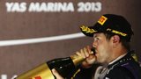 Sebastian Vettel drinks champagne at Yas Marina