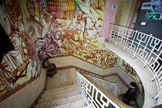 Photo: A large mural painted across a stairwell inside the former U.S. Embassy compound. It's an Iranian interpretation of American foreign policy, beginning with the 9/11 attacks, at the bottom of the stairs. (Muhammad Lila/ABC News)

More photos: http://abcn.ws/1dIyxJn
Video tour: http://abcn.ws/17Ils1x