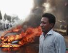 A Bangladeshi man cries after his vehicle was set on fire by Islamist party Jamaat-e-Islami activists following the execution of their party leader Abdul Quader Mollah in Dhaka, Bangladesh, Friday, Dec. 13, 2013. The execution of the opposition leader in Bangladesh sparked violent protests Friday as activists torched homes and businesses belonging to government supporters, leaving at least three people dead, in a fresh wave of bloodshed ahead of elections next month.