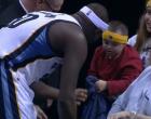 
	Zach Randolph gives a special needs fan his warm up jersey. 
