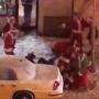 Brou-Ho-Ho! Santas scuffle on the corner of 17th St. and Third Avenue in Manhattan Saturday night.