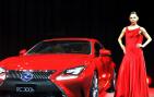 Ravishing in red! This model strikes a pose next to the Lexus RC 300h hybrid vehicle at the Tokyo Motor Show.