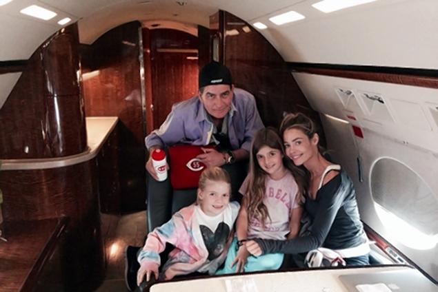 
	Charlie Sheen Twitter photo with Denise Richards and their daughters, Samantha and Lola, aboard his jet at Van Nuys Airport, posted November 16, 2013. Caption reads:
