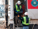 NTSB investigators retrieve a black box event recorder from the derailed Metro North train. (Credit: NTSB)