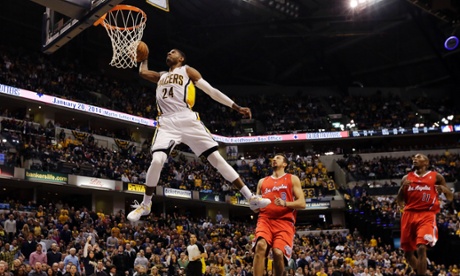 Indiana Pacers forward Paul George dunks on the Los Angeles Clippers, entire world.