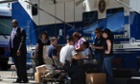 FBI agents work at a command post after raids were conducted on money-laundering operations in the Fashion District of Los Angeles.