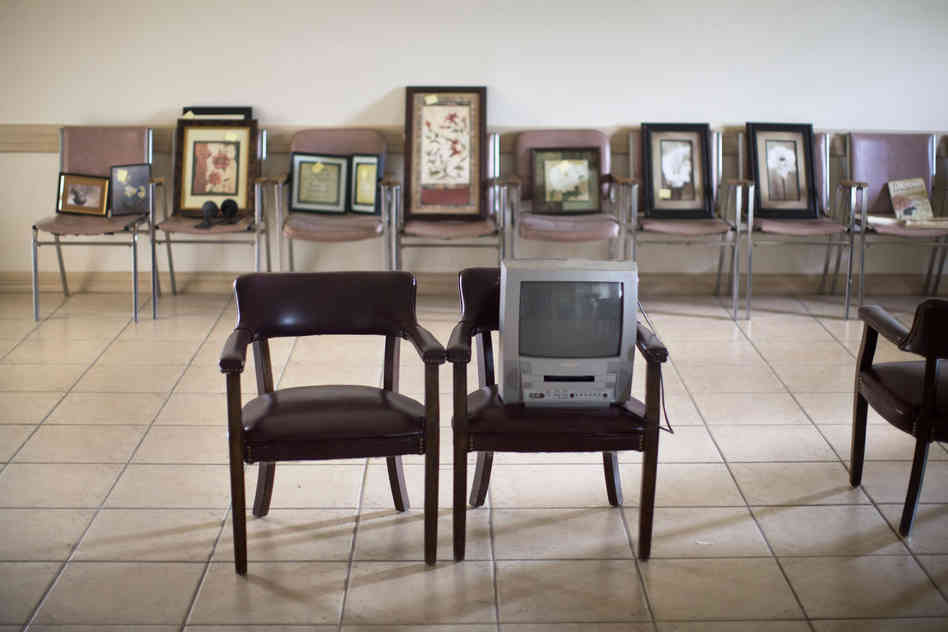 Artwork that once hung on the waiting room walls now sits in empty chairs. After he closed the clinic earlier this year, Minto and his staff packed up and sold much of the contents.