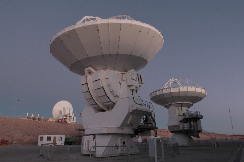 Three antennas await repair at ALMA's low site. Each antenna seen here is designed by a different collaborator --
         be it Europe, North America or South Asia -- while Chile's involvement in this worldwide astronomical project cannot
         be understated; ALMA's array of 66 antennas rest in the country's Atacama Desert. Photo by Joshua Barajas/PBS NewsHour