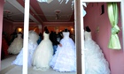 Wedding gowns in a shop window in Reyhanli