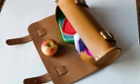 A satchel with an apple in it