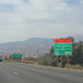 Interstate 10 Westbound Desert Cities - Sonny Bono Memorial Freeway reminds motorists reminding you safely to know "Putting America to Work, Project Funded by Caltrans and the America Recovery and Re-Investment Act" with this roadside sign followed by