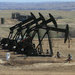 Oil wells like these in North Dakota have helped ramp up production to 8.7 million barrels a day, the most in nearly 25 years.