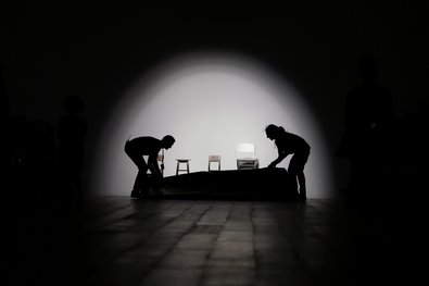 Workers prepare a catwalk during London Fashion Week.