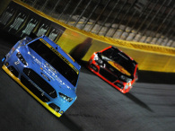 Brad Keselowski, driver of the #2 Detroit Genuine Parts Ford, races Tony Stewart, driver of the #14 Bass Pro Shops / Mobil 1 Chevrolet, during the NASCAR Sprint Cup Series Bank of America 500 at Charlotte Motor Speedway on October 11, 2014 in Charlotte, North Carolina.  (Photo by Jonathan Moore/Getty Images)